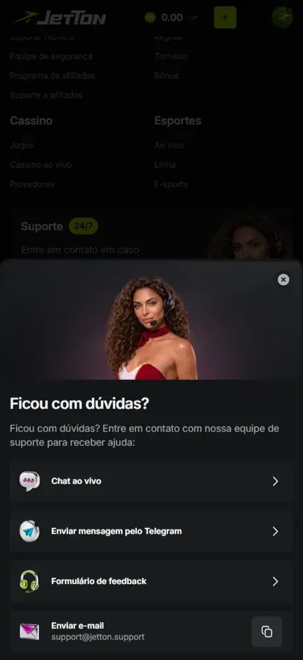 Janela Ficou com dúvidas? da Jetton com as opções Chat ao vivo, Enviar mensagem pelo Telegram, Formulário de feedback e Enviar e-mail support@jetton.support com botão de copiar, sobre o rodapé com Suporte 24/7